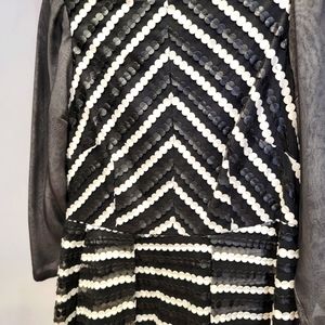 Designer Eva Franco dramatic white and black dress